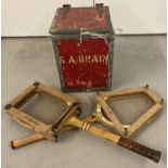 A vintage wooden storage crate with metal banding painted red and marked S. A. Brain.