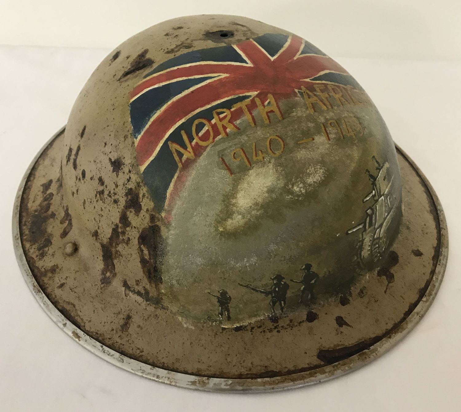 A WWII style British Brodie helmet with post war hand painted 8th Army memorial detail.