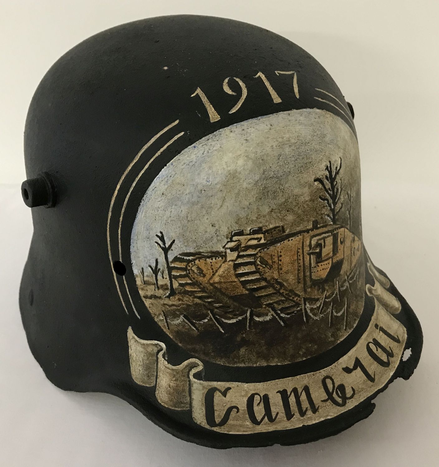 A WWI style German Stahlhelm helmet with post war memorial painting referencing Cambrai, 1917.