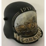A WWI style German Stahlhelm helmet with post war memorial painting referencing Cambrai, 1917.
