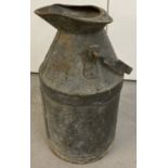 A vintage galvanised 5 gallon dispensing can with weight & measure lead seal to inside pouring lip.
