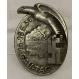 A WWII style Gau Tag Koblenz metal badge with eagle detail.