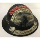 A British WWI style Brodie helmet with post war memorial hand painted detail.
