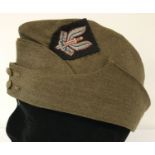 A WWII style British Army side cap with hand embroidered S.A.S cap badge sewn on.