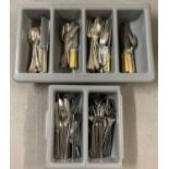 2 trays of modern and vintage cutlery in varying designs.