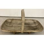 A traditional wooden garden shallow shaped trug.