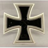 A reproduction Iron Cross tunic badge.