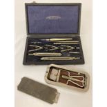 A vintage boxed Lawes Rabjorns scientific instrument set together with a Rolls razor.