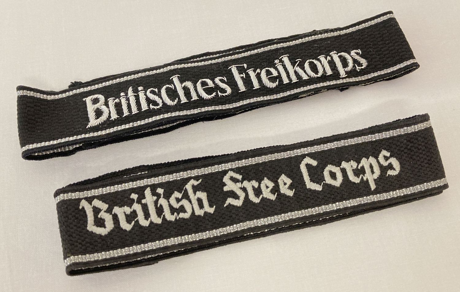 A pair of reproduction "British Free Corps " cuff titles.