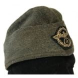 A German WWII style 1936 pattern Schutzpolizei side cap.