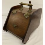 A vintage mahogany coal box complete with coal scoop and liner.