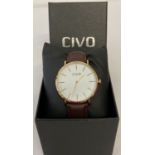 A boxed men's wrist watch by Civo. White dial with gold tone case, hours markers and hands.