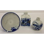 3 small items or blue and white oriental ceramics. 2 vases and a small dish.