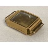 A vintage 18ct gold ladies wristwatch case complete with glass. Gold marks to back of case.