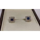A pair of 9ct white gold, sapphire and diamond square shaped stud earrings.