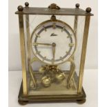 A vintage German brass cased Kern torsion pendulum Anniversary clock.