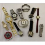 A box of ladies and men's wristwatches in varying styles and conditions.