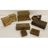 A collection of vintage small wooden boxes together with a wooden ashtray with bird detail.