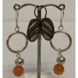 2 pairs of silver drop style earrings. A pair set with mother of pearl with marcasite set overlays.