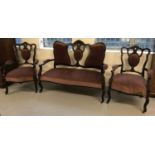 A Victorian 2 seater wooden framed Parlour suite; settee with 2 matching arm chairs.
