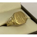 A men's 18ct gold cut through signet ring suitable for scrap.