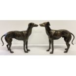 A large pair of cast metal bronzed effect greyhound figurines.