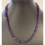 A 16" faceted amethyst beaded necklace with 9ct gold lobster claw clasp.
