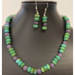 A 19" amethyst and turquoise beaded necklace and matching drop earrings.