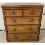 A Victorian 2 over 3 chest of drawers with original knob handles.