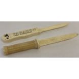 2 bone letter openers with carved detail to handles.