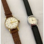 2 ladies vintage wristwatches. An Excalibur with white dial and gold tone hands and hour markers.