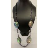 A long length amethyst and hematite beaded necklace with large abalone shells.