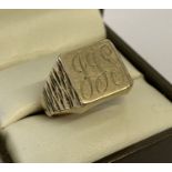 A vintage design 9ct gold men's square signet ring with diamond cut pattern to shoulders.