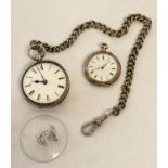 An antique silver pocket watch with engine turned decoration to back and empty cartouche.