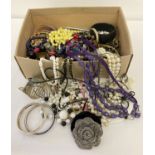 A box of modern costume jewellery to include bangles bracelets and necklaces.