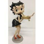 A heavy painted cast iron figurine of Betty Boop as a waitress.