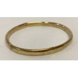 A 9ct scrap gold bangle.