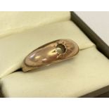 A vintage rose gold gypsy style ring with central stone missing.