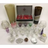 A box of assorted glassware to include vases, paperweights and glasses.