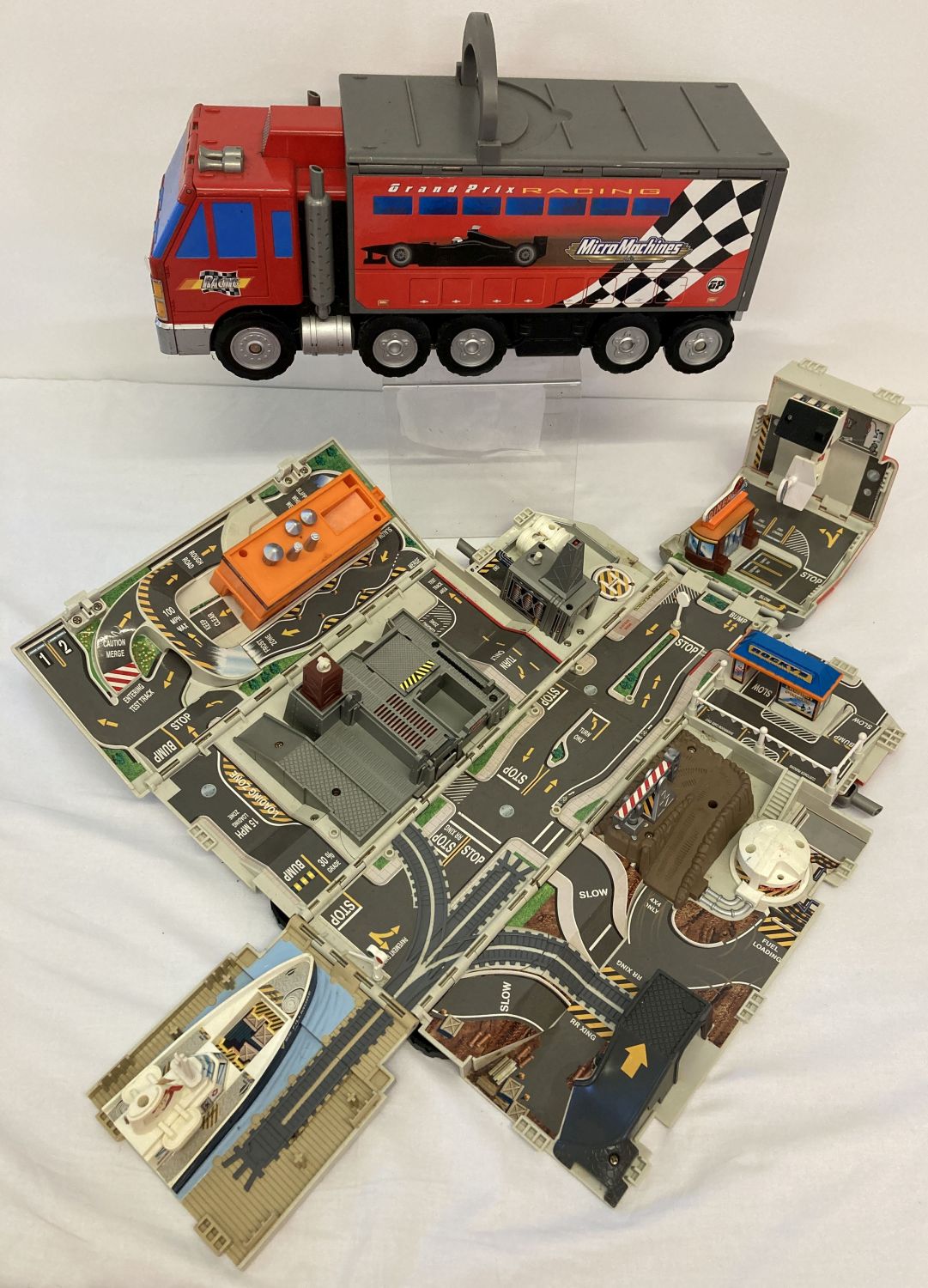 2 x 1990's Micro Machines large truck fold out playsets.