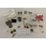 26 pairs of vintage and modern costume jewellery earrings in both drop and stud styles.