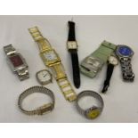 A small collection of men's and ladies wristwatches in varying styles and conditions.