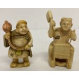 2 carved resin netsukes in the shape of Oriental gentlemen.