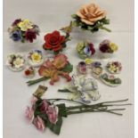 A box of assorted ceramic flower and posy ornaments.