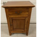A single drawer with under cupboard wooden bedside cabinet.