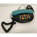 A limited edition retro style Geemarc 3000 push button phone with bright handset and buttons.