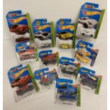 12 Hot Wheels 1:72 scale diecast vehicles. All still sealed in original packaging.