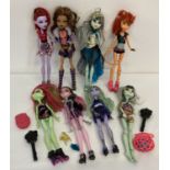 A collection of 8 Monster High dolls by Mattel with a small selection of accessories.