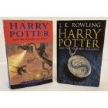 A hardback copy of "Harry Potter and the Goblet of Fire" by J.K. Rowling, printed by Omnia Books.