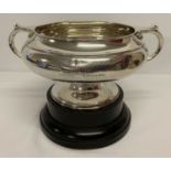 A solid silver rose bowl with plinth and dedication to front marked Munsey & Co Ltd, Cambridge.